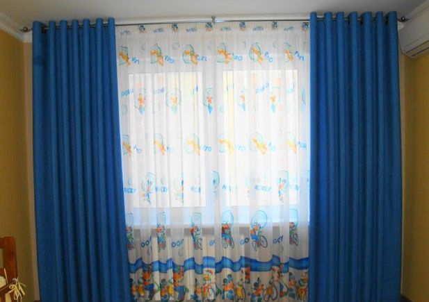 Traditional style curtains in a nursery for a boy
