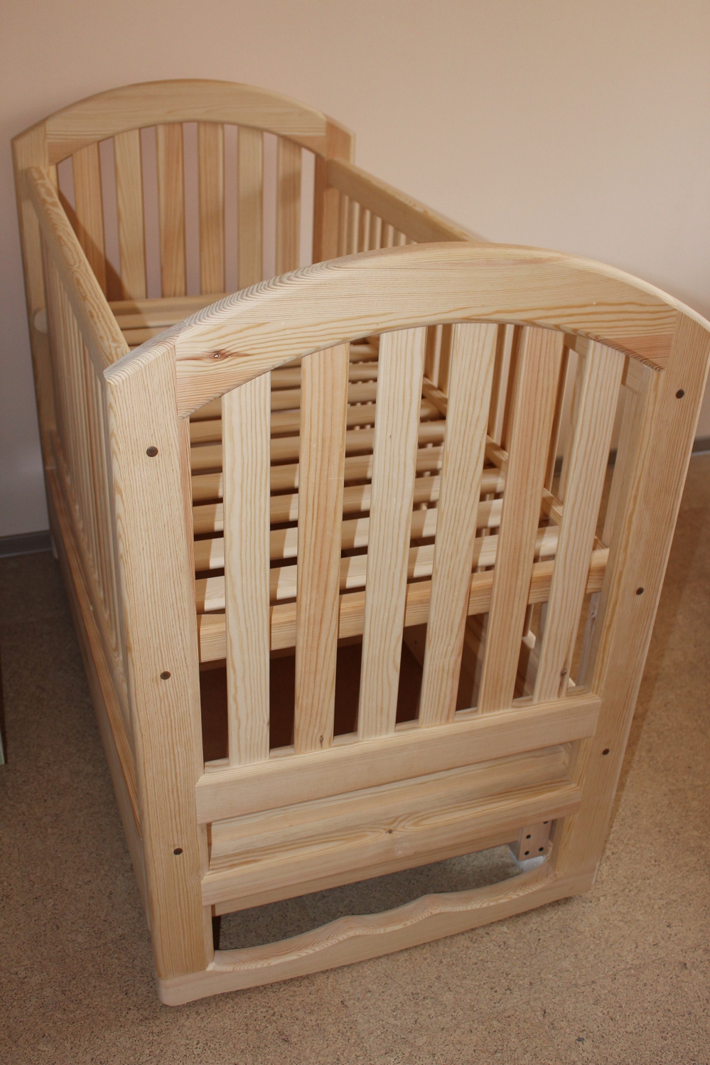 Wooden crib for a newborn baby