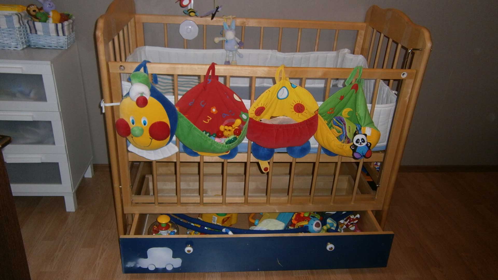 Children's bed with built-in bottom drawers