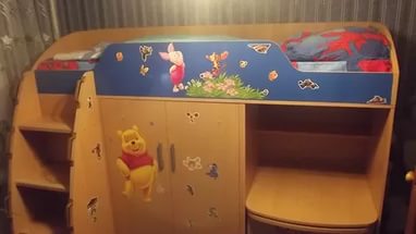 Children's bed transformer with built-in chest of drawers and wardrobe for a small bedroom