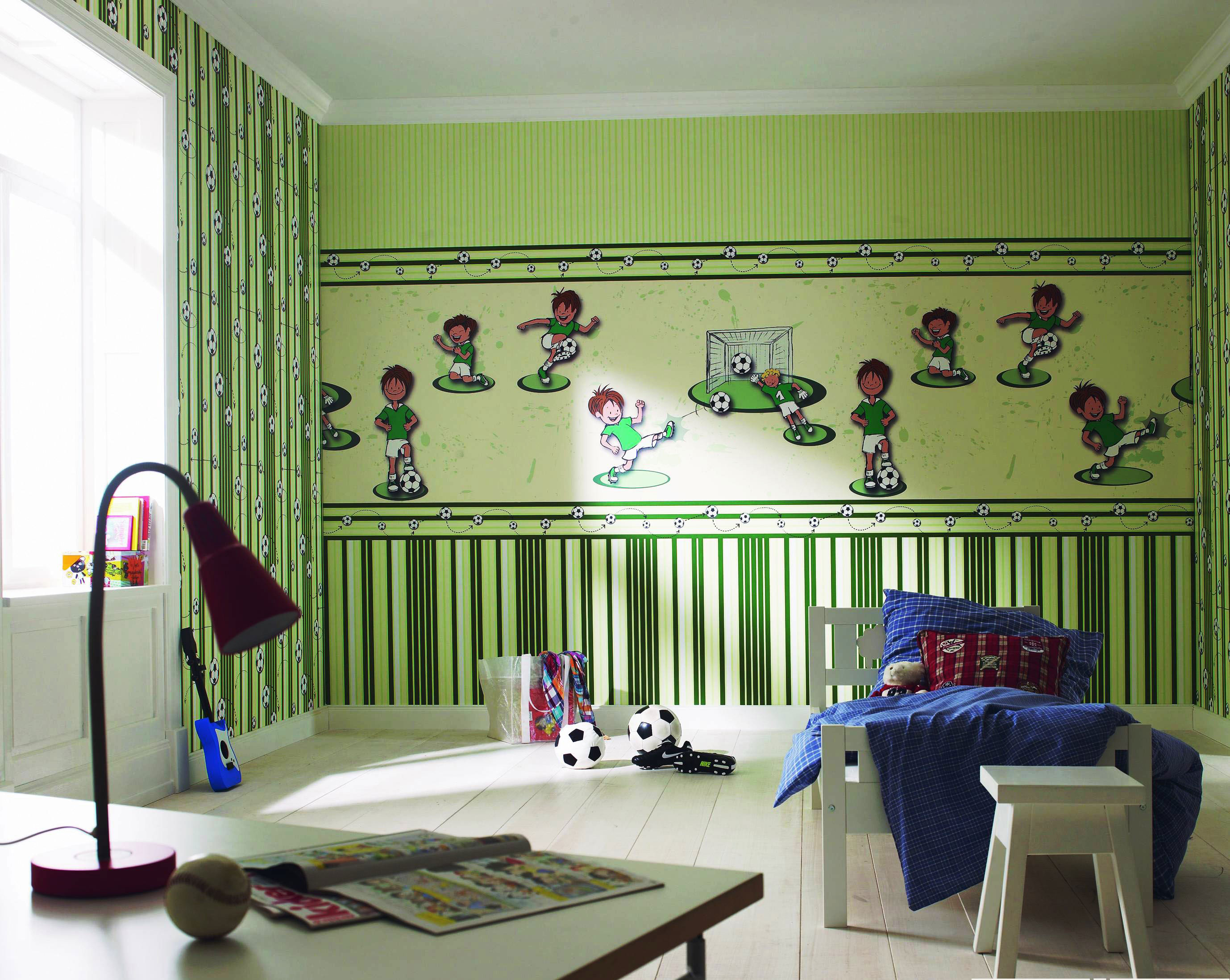 Wall mural with themed sports drawings in a nursery