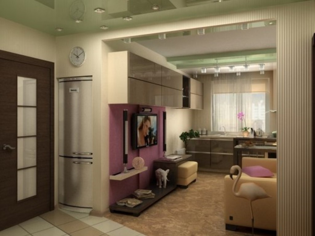 The interior of a small kitchen-living room in bright pink