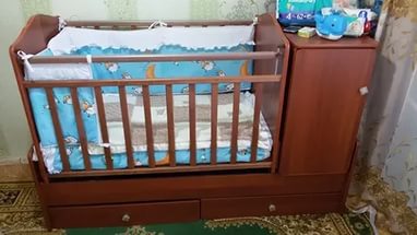 Children's bed transformer with built-in changing table