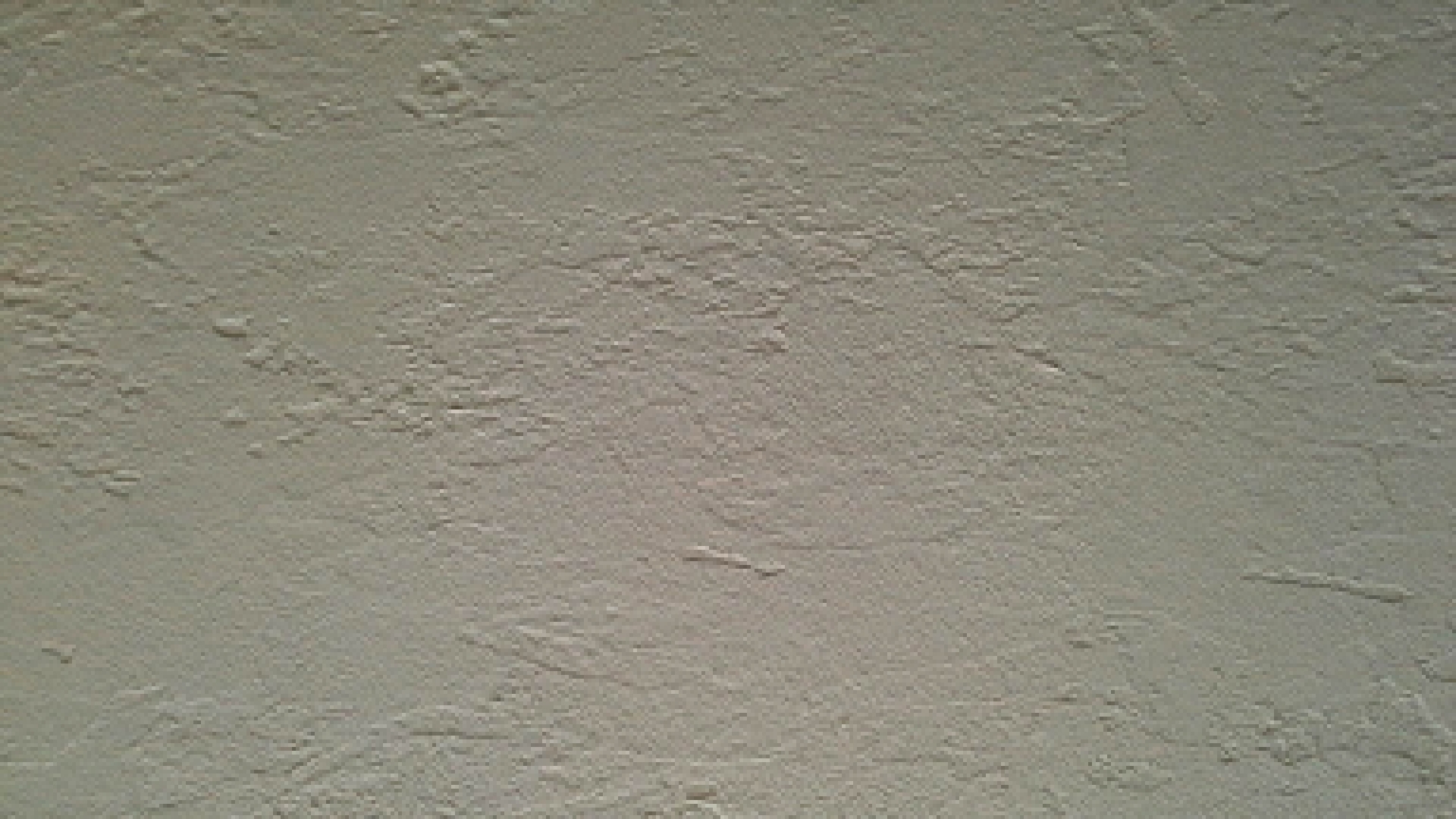 The method of priming a concrete wall before applying the finish