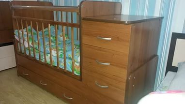 Convenient and comfortable baby bed with a changing table