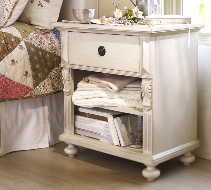 The purpose of the bedside table in the bedroom