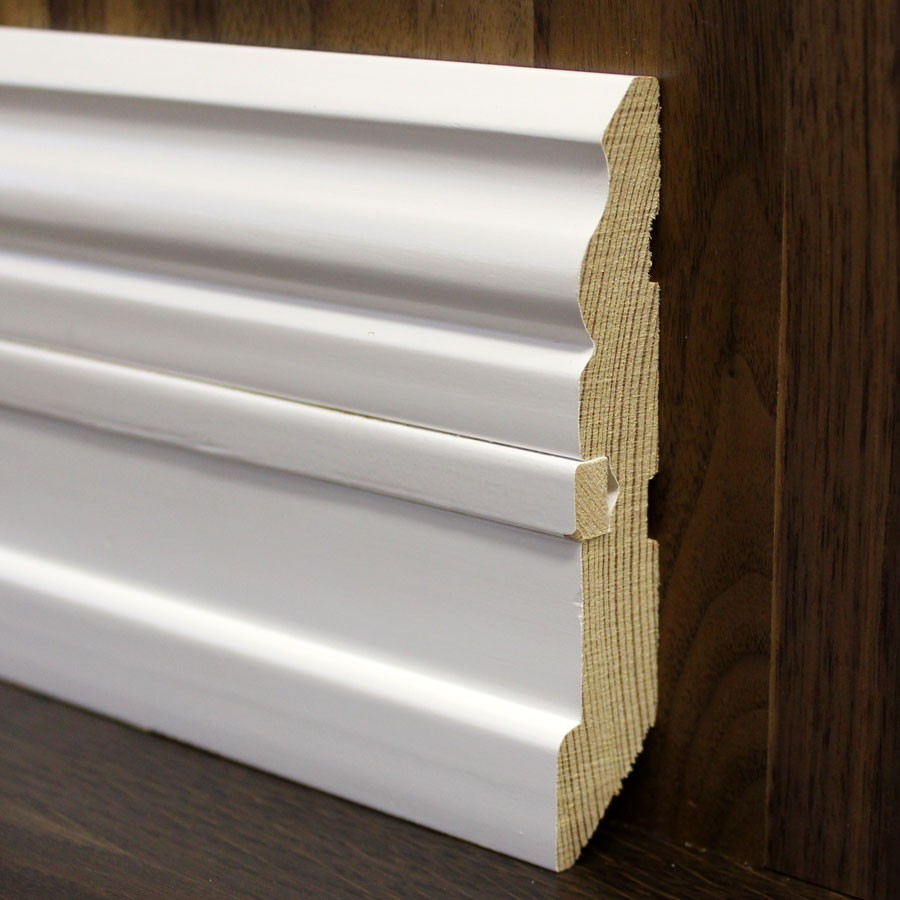 white baseboard made of wood in the interior of the apartment