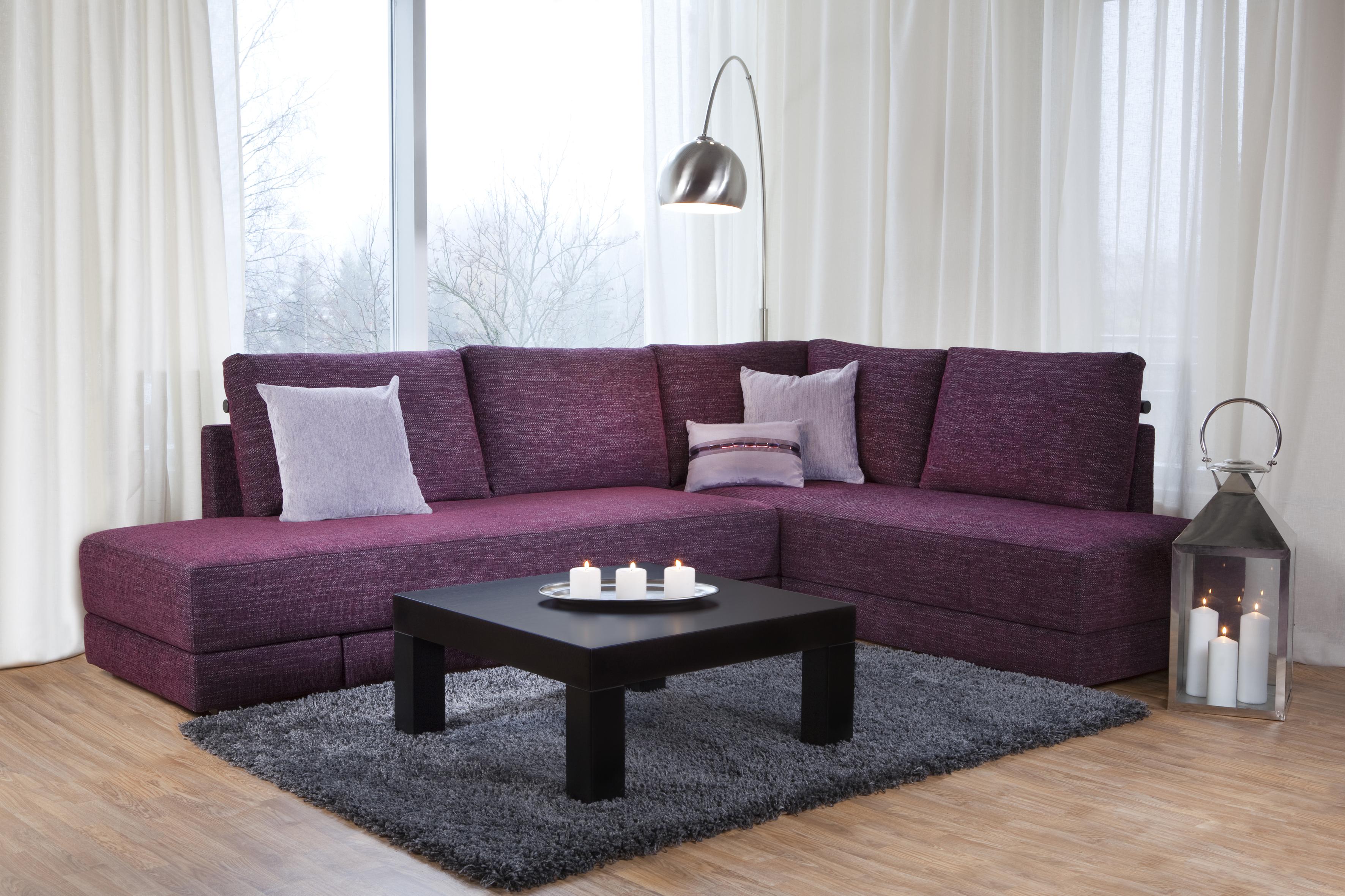 dark corner sofa in the design of the living room