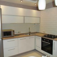 bright design of a white kitchen with a touch of beige photo