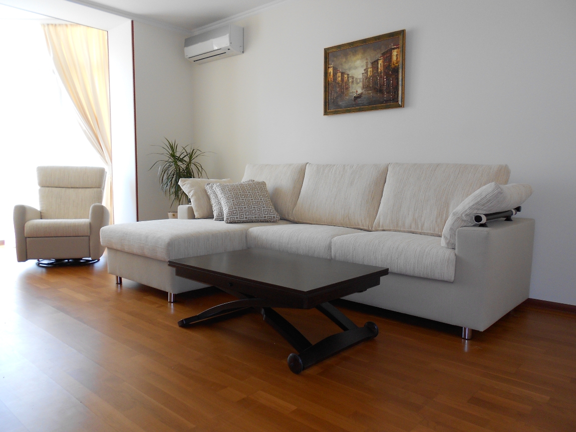 bright corner sofa in the design of the apartment
