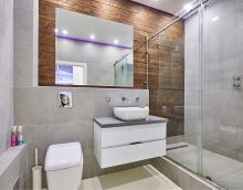 bright design of a bathroom with a shower in bright colors