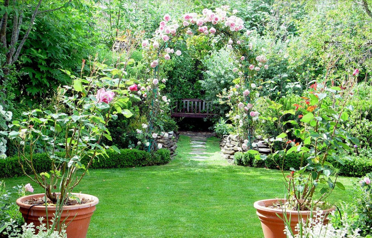 beautiful landscaping of a summer cottage in the English style with flowers