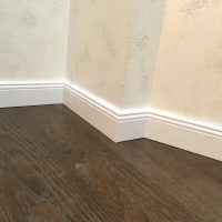 light plastic baseboard in the interior of the house photo