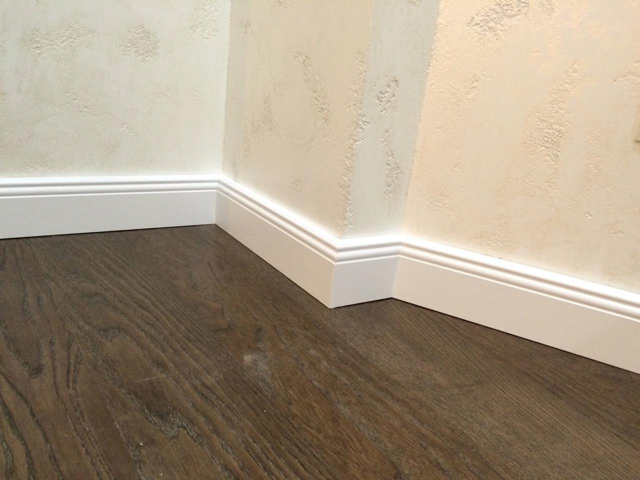 light plastic baseboard in the interior of the room