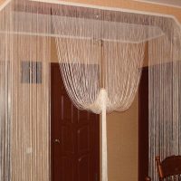 unusual curtains of thread in the design of the hallway photo