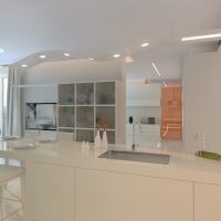 bright interior of a white kitchen with a touch of pink picture