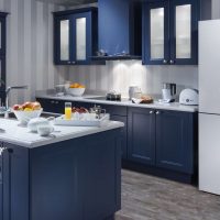 large refrigerator in the design of the kitchen in gray photo