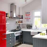 large refrigerator in the decor of the kitchen in bright color photo