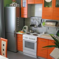 large refrigerator in the design of the kitchen in the dark color photo