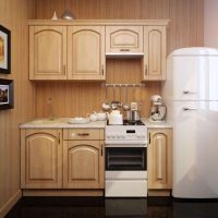 small refrigerator in the decor of the kitchen in black color photo