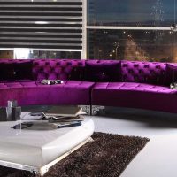 dark purple sofa in the design of the bedroom photo