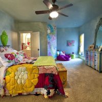 bright decor of the bedroom in the style of boho photo