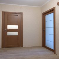 wooden doors in the design of the apartment photo