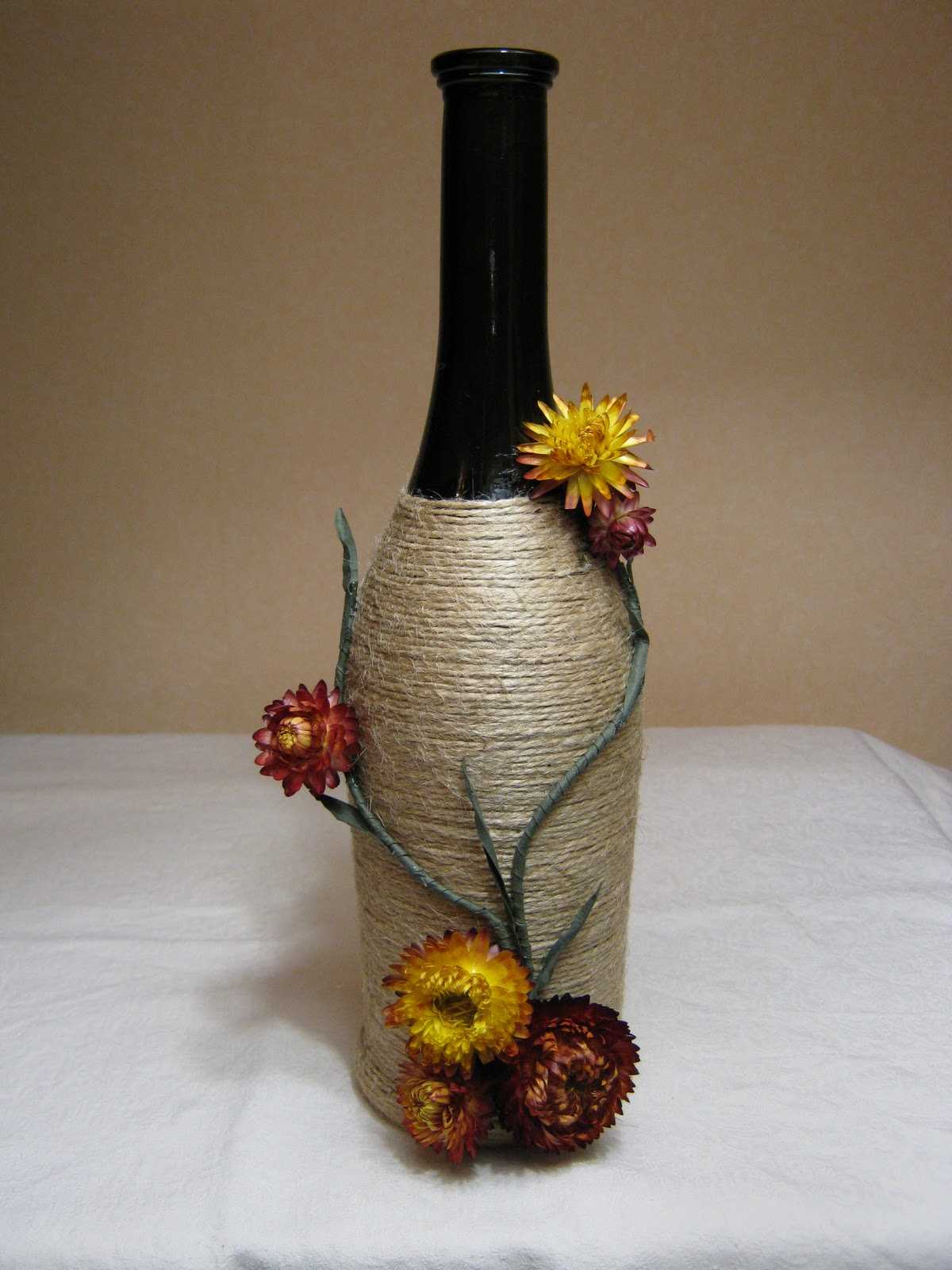 a variant of the original decoration of glass bottles with twine