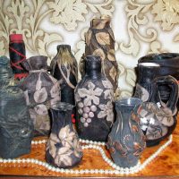 do-it-yourself version of a chic decoration of bottles of leather photo