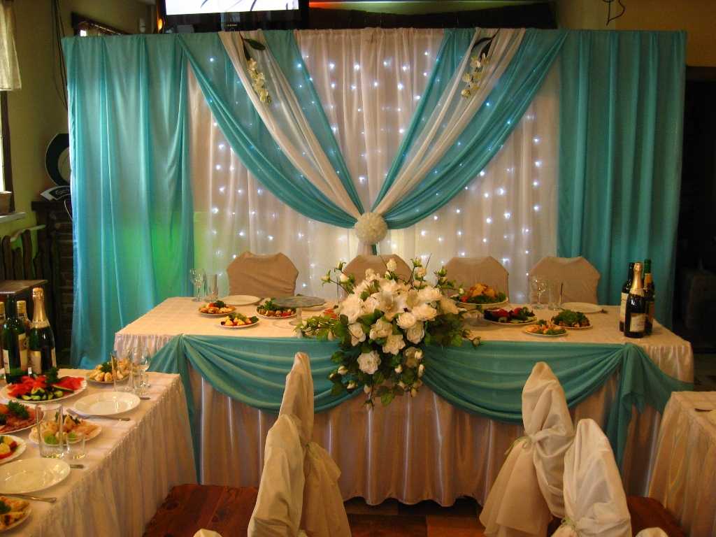 light decoration of the wedding hall with flowers