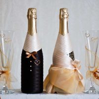 unusual decoration of glass bottles with decorative ribbons photo