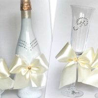 chic decoration of champagne bottles with decorative ribbons picture