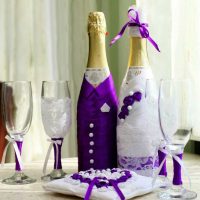 original decoration of champagne bottles with colorful ribbons photo