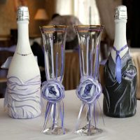 original design of champagne bottles with colorful ribbons photo