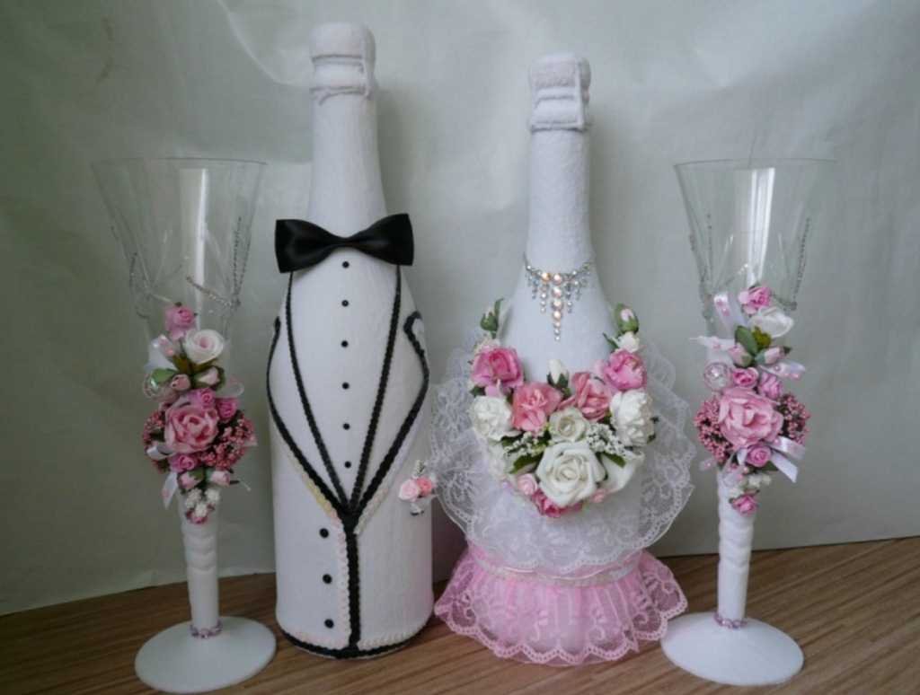 bright decoration of champagne bottles with decorative ribbons