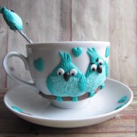 unusual decoration of the mug with polymer clay animals at home photo