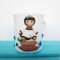 unusual do-it-yourself mug decoration with polymer clay animals photo