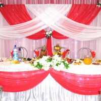 bright decoration of the wedding hall with ribbons photo