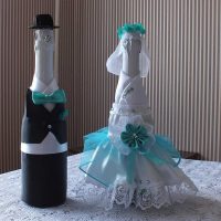 unusual design of champagne bottles with decorative ribbons photo