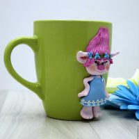unusual do-it-yourself mug decoration with polymer clay animals picture