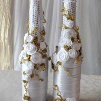 unusual decoration of champagne bottles with decorative ribbons picture