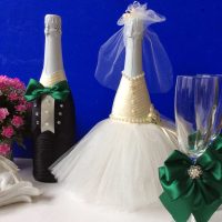 chic decoration of champagne bottles with colorful ribbons photo