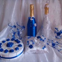 beautiful decoration of champagne bottles with colorful ribbons photo