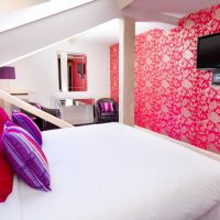 a combination of bright pink in the style of the bedroom with other colors of the photo