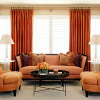 a combination of dark orange in the design of the room with other colors of the photo