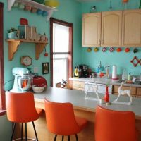 combination of bright orange in the design of the apartment with other colors