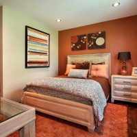 a combination of bright orange in the style of the apartment with other colors of the photo