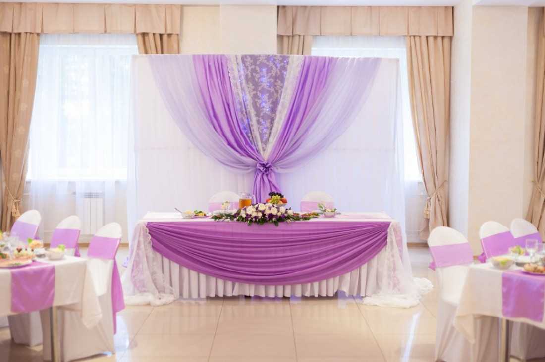 beautiful decoration of the wedding hall with ribbons