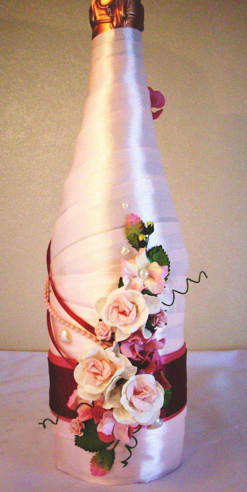 beautiful decoration of champagne bottles with colorful ribbons