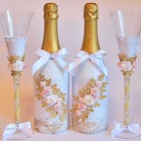 chic decoration of glass bottles with decorative ribbons photo